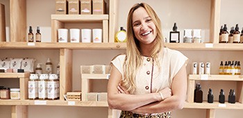Happy small business owner in her shop