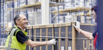 Person moving a pallet of boxes