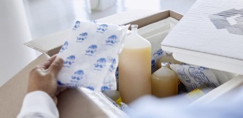 Insulated package with chilled contents being prepared for shipping